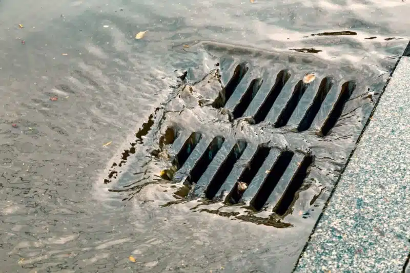stock-photo-stormwater-street-drain-during-heavy-rain-rain-flowing-into-a-storm-water-sewer-system-color